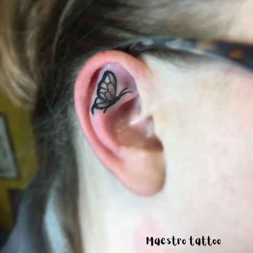 small butterfly tattoo behind ear image