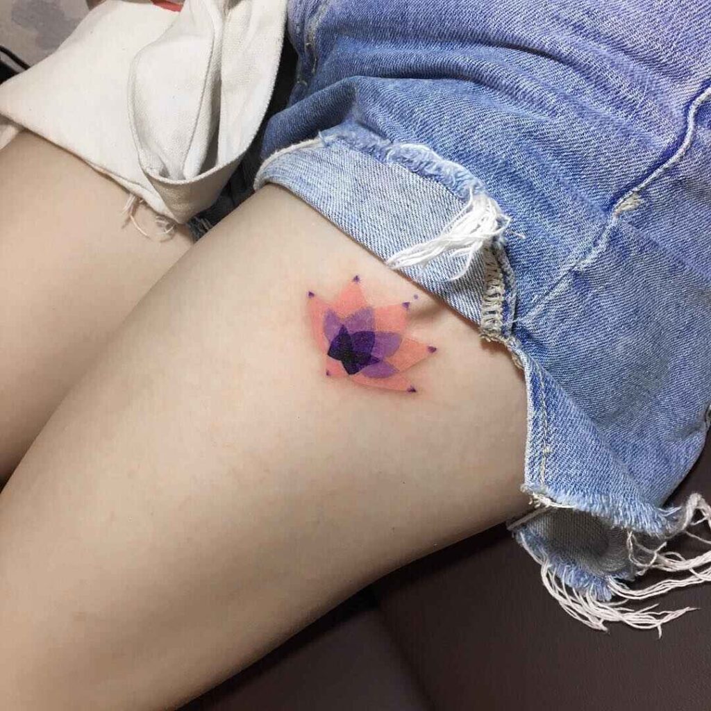 Colorful lotus flower tattoo on the thigh 1 by maestro tattoo