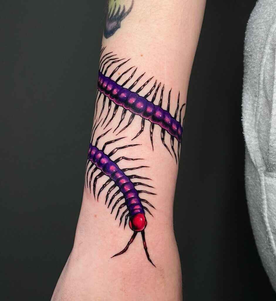 watercolor arm centipede tattoo